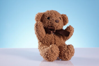 Teddy bear with blue background