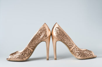 Ornately designed bronze sandals