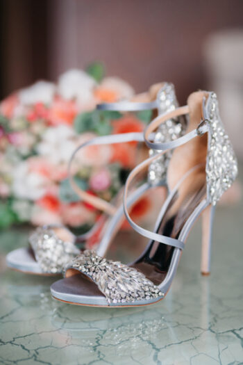 Ivory high heeled shoes and floral bouquet