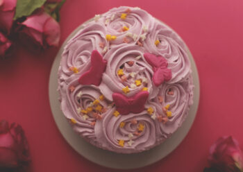 Aerial view of rose and butterfly cake