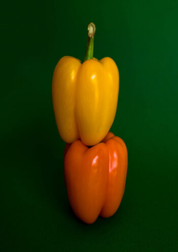 Peppers on green background