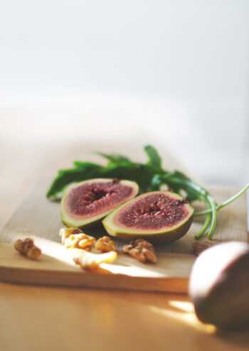 Sliced fig and walnuts