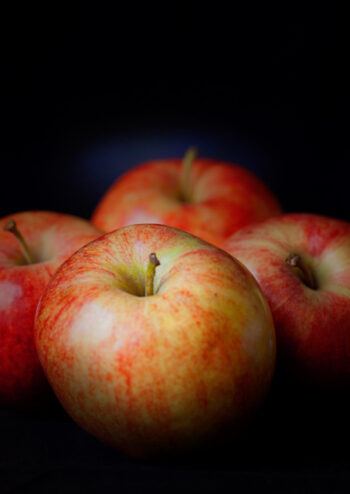 Red apples with black background
