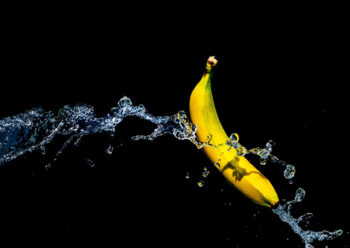 Banana with running water with black background