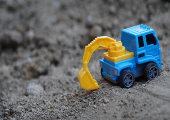 Blue and yellow toy digger