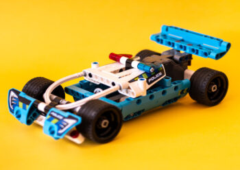 Toy racing car with a yellow background