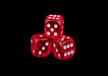 Red dice with black background