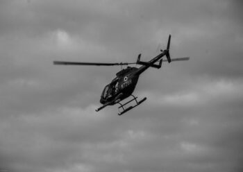 Helicopter in flight black and white