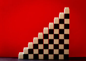 White and black building blocks with red background