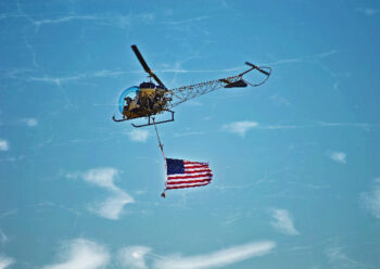 Helicopter flying American flag
