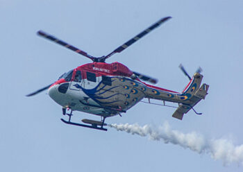 Indian air force helicopter with smoke