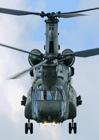 Front view of a military helicopter in flight
