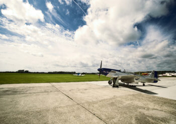Blue and grey propeller plane in airfield