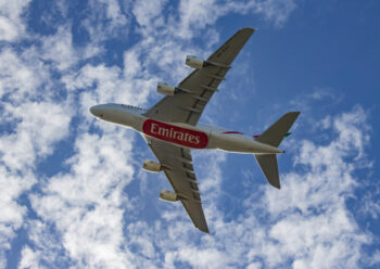 Underside of Emirates plane in flight