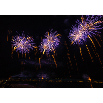 Blue fireworks over a city