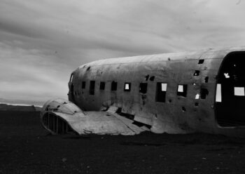 Plane wreckage in black and white