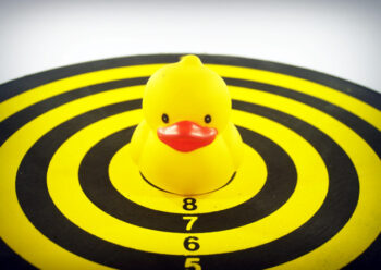 Yellow rubber duck on games board