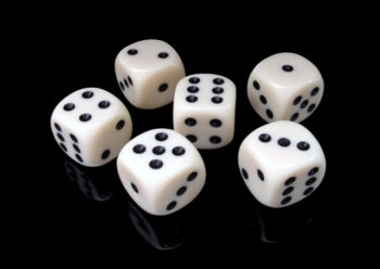 A collection of dice on black background
