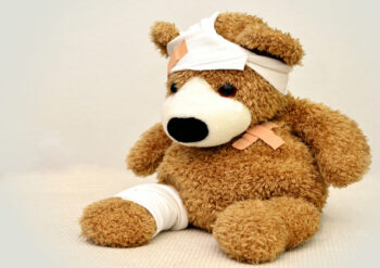 Teddy bear with a plaster and bandages