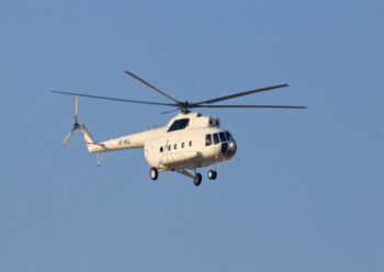White helicopter in flight
