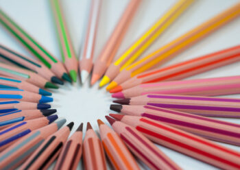 Coloured pencils arranged in a circle