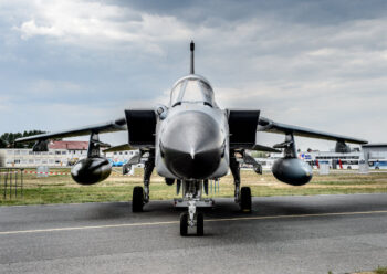 Front view of a fighter jet on airfield