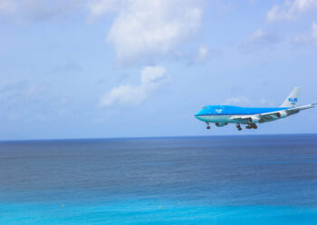 Plane coming in to land over the sea