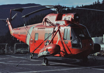 Red helicopter on helipad