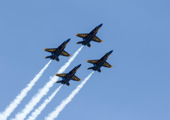 Underside view of Blue Angels flying in formation