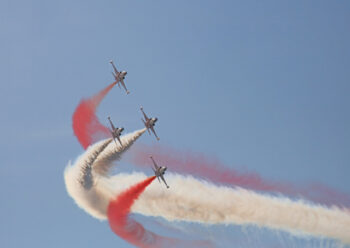 Air display team with white and red smoke