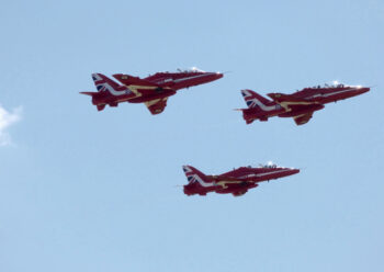 Three Red Arrows hawks in flight