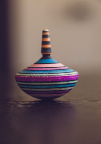 Multi coloured spinning top